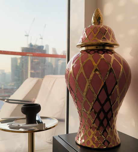 Amira decorative urn with a refined design, featuring intricate patterns and a polished finish, perfect for adding elegance and charm to any space.