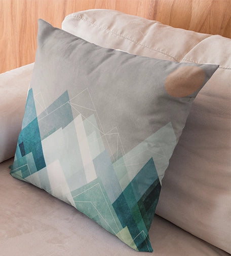 A cushion featuring bold geometric shapes and angular patterns inspired by Cubism, with a mix of vibrant colors and abstract forms for a modern, artistic touch.