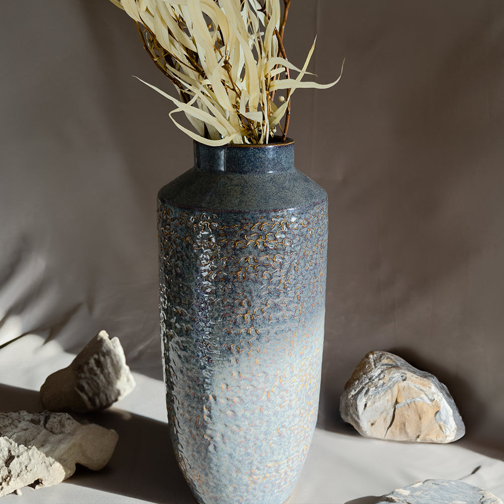 Hajr terracotta vase with a rustic, earthy design, featuring natural tones and textured finishes, perfect for adding a warm and organic touch to any space.